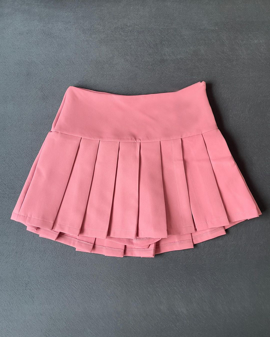 Falda corta plisada mini