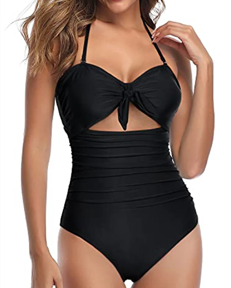 Traje de baño de una pieza triangular ajustado con escote halter, espalda descubierta, lazo y abertura en el vientre